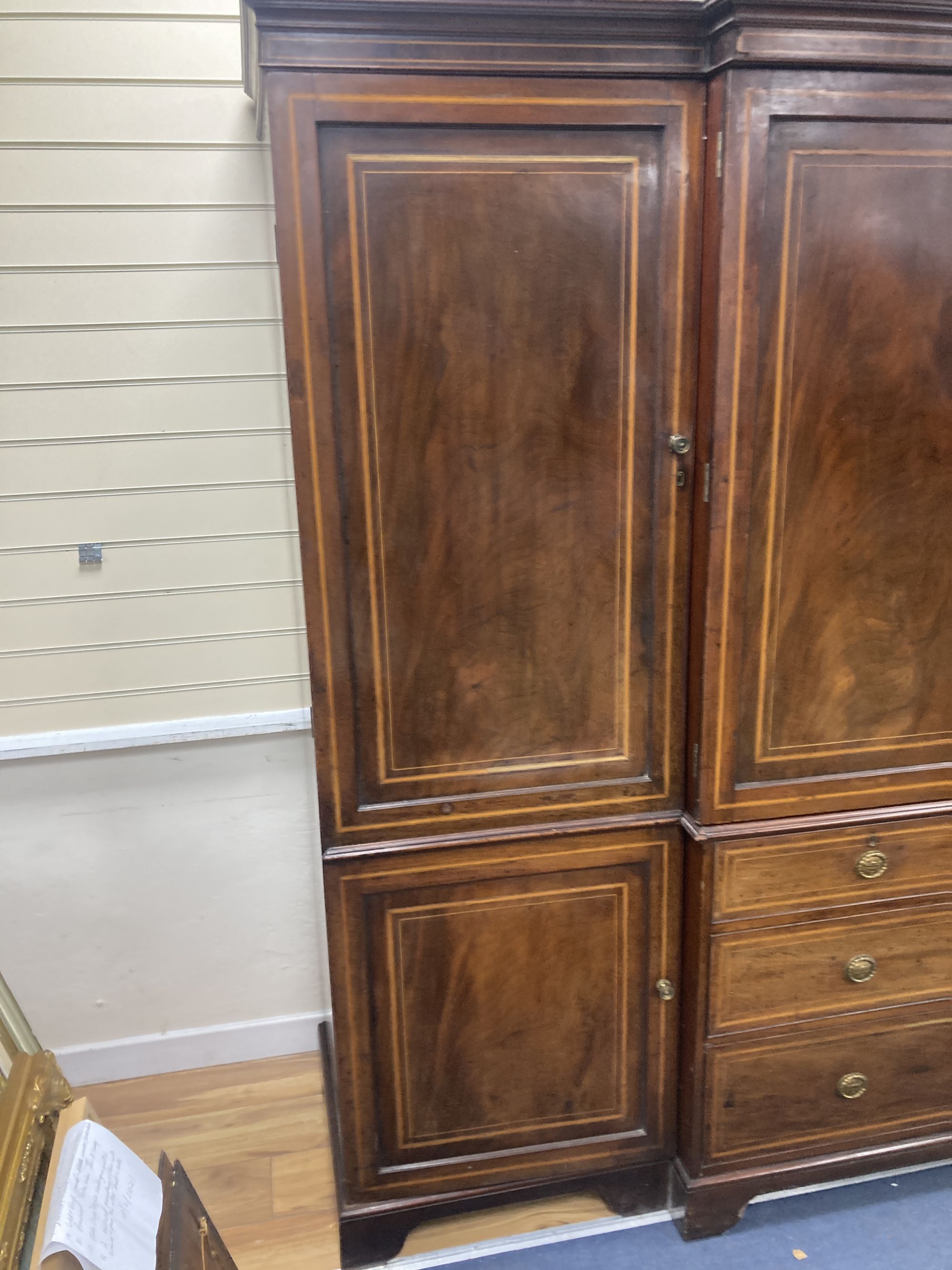 An Edwardian satinwood banded mahogany breakfront wardrobe, length 250cm, depth 65cm, height 230cm